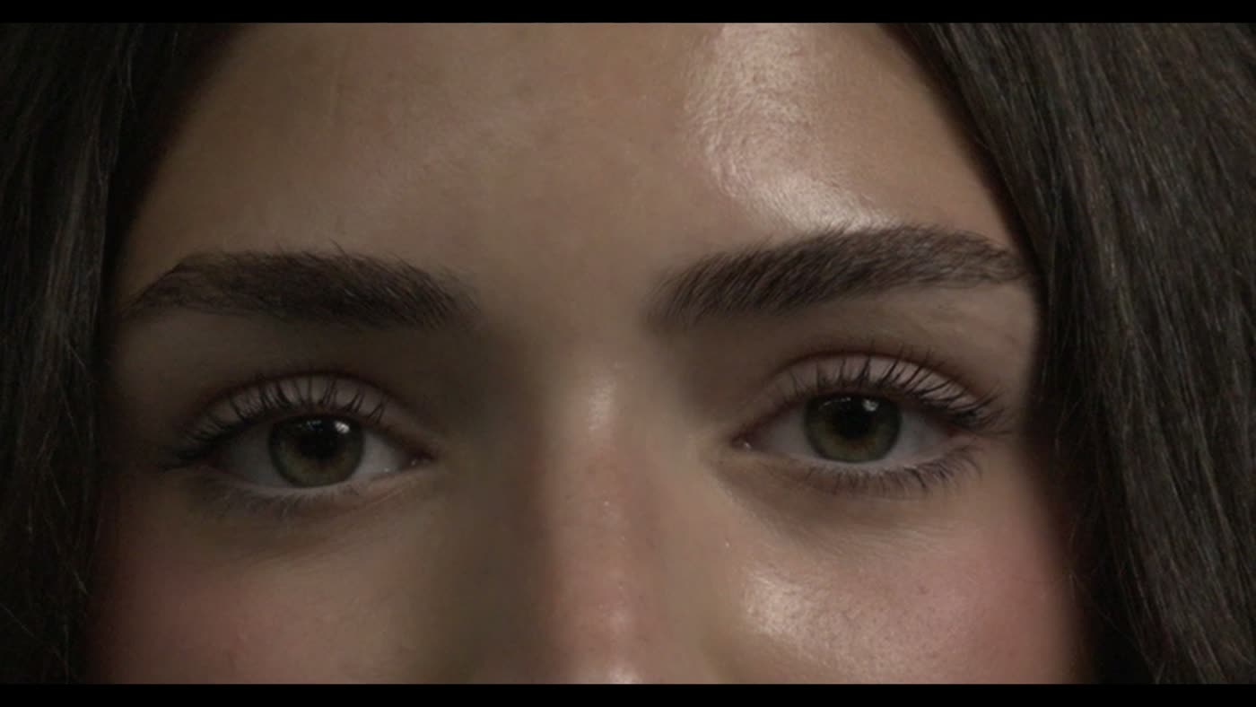 Extreme close-up of a Moline volleyball player’s eyes during a media-day portrait